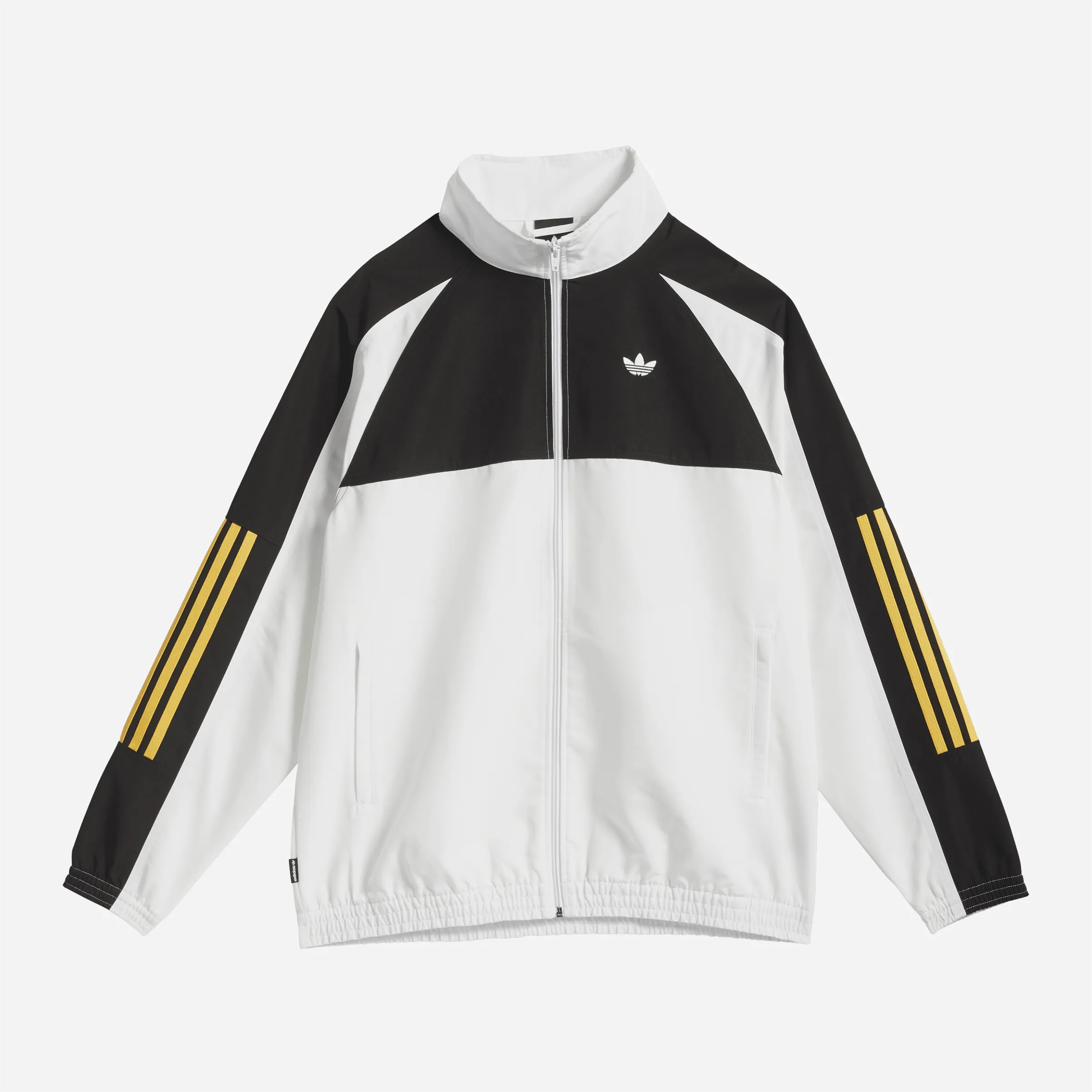 Veste de survêtement Adidas Skateboarding blanche et noire coupe large.