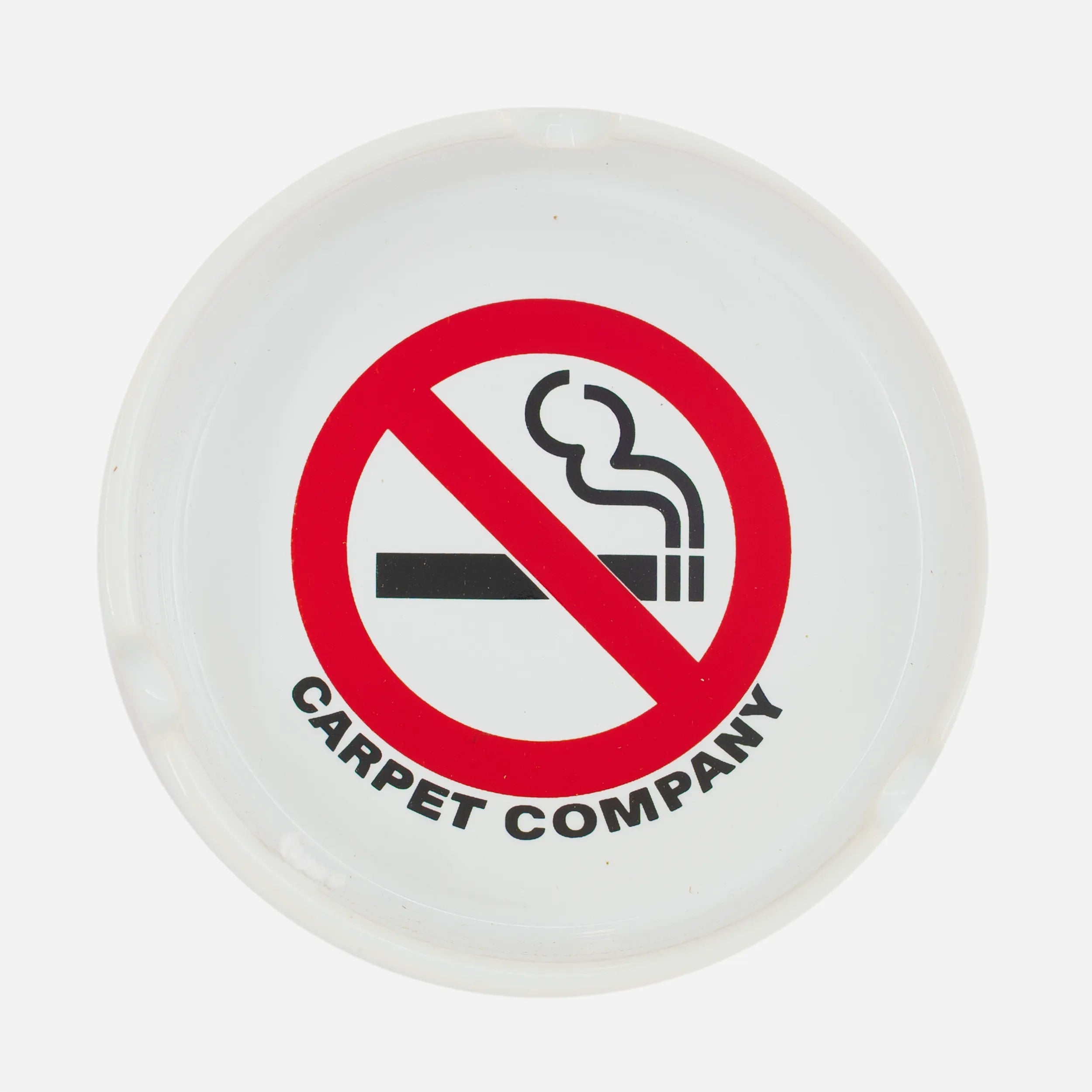 Carpet Company Smoking Kills white ceramic ashtray.