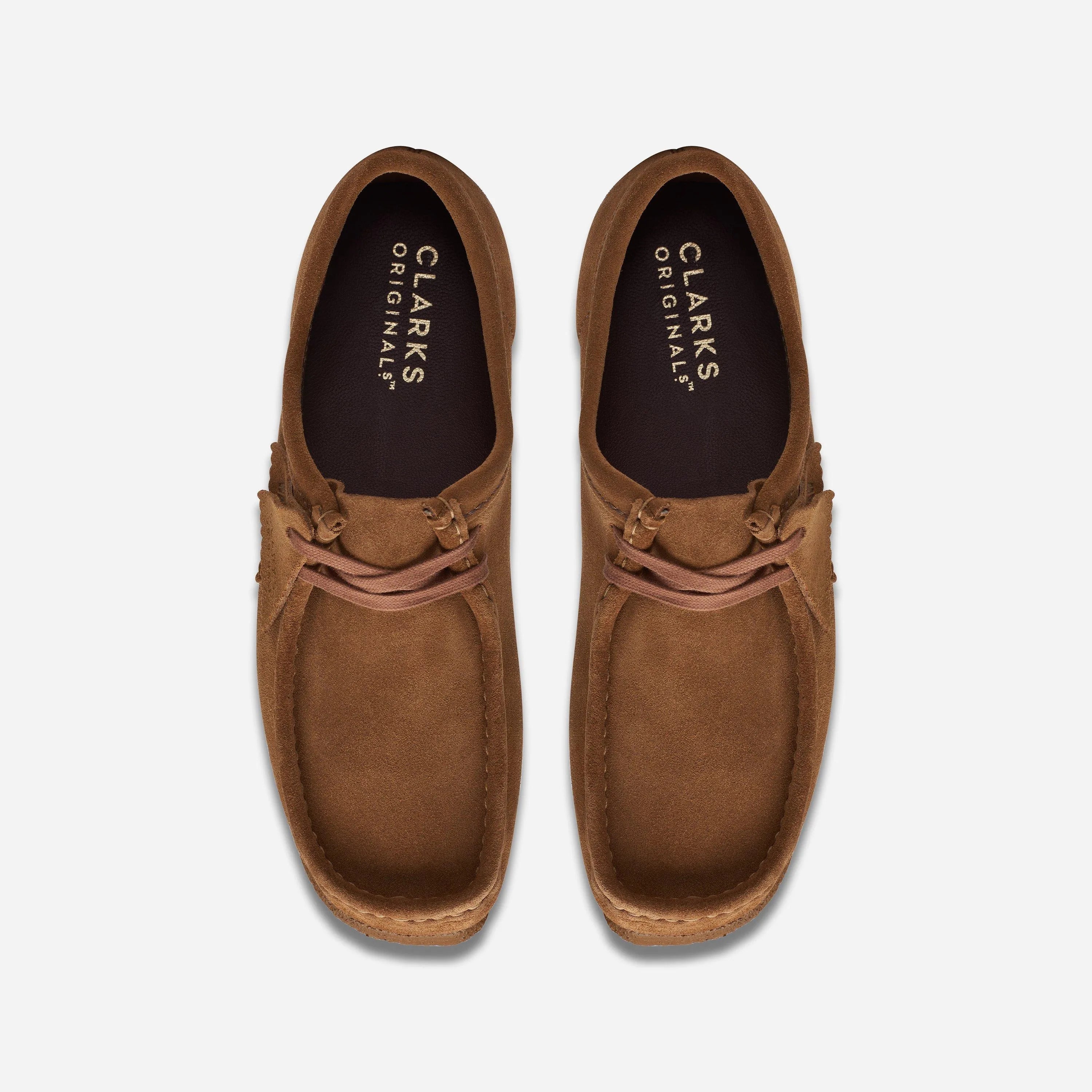Top-down view of the Clarks Wallabee Cola shoes showcasing the asymmetrical moccasin construction and leather lining.