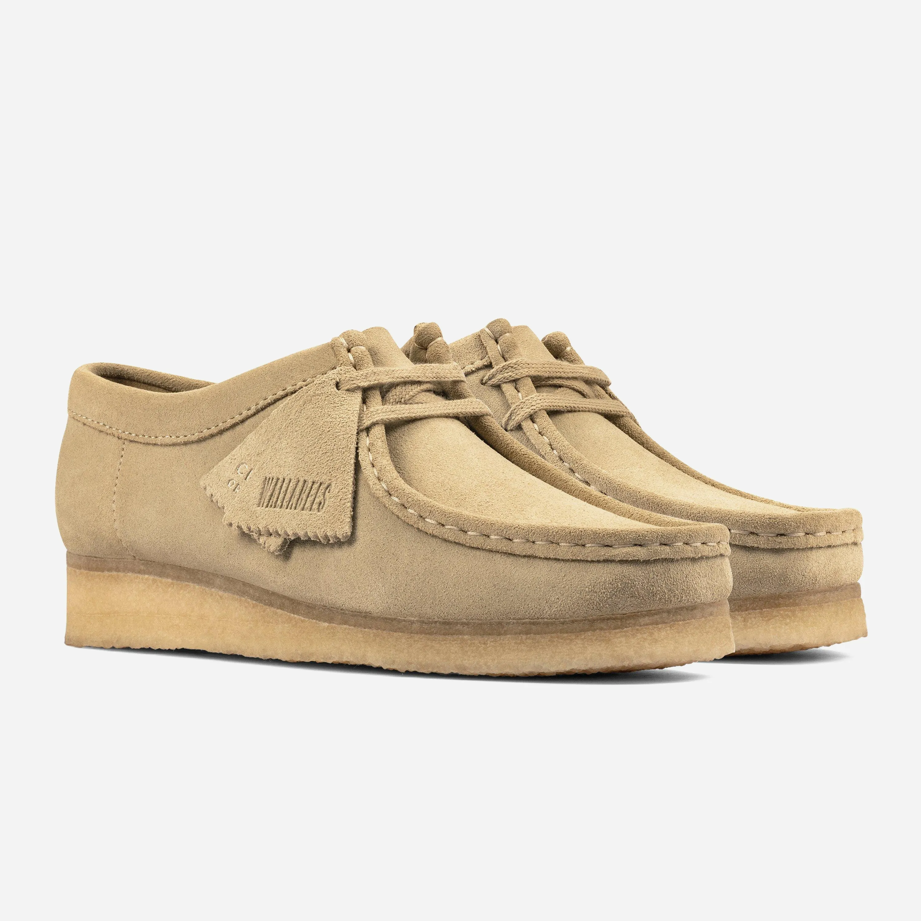 Three-quarter view of the women's Clarks Originals Wallabee shoes in maple suede with tags and crepe sole.