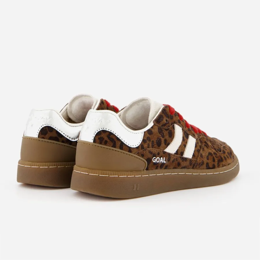 Vue arrière des baskets montrant l'empiècement chromé au talon et le logo Goal.