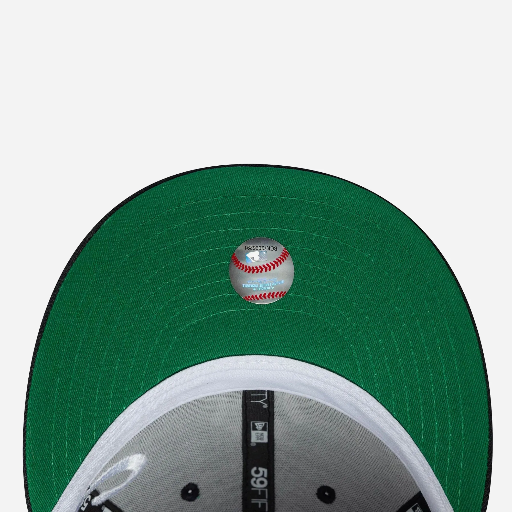 Detail of vintage green visor underside on New Era Yankees cap.