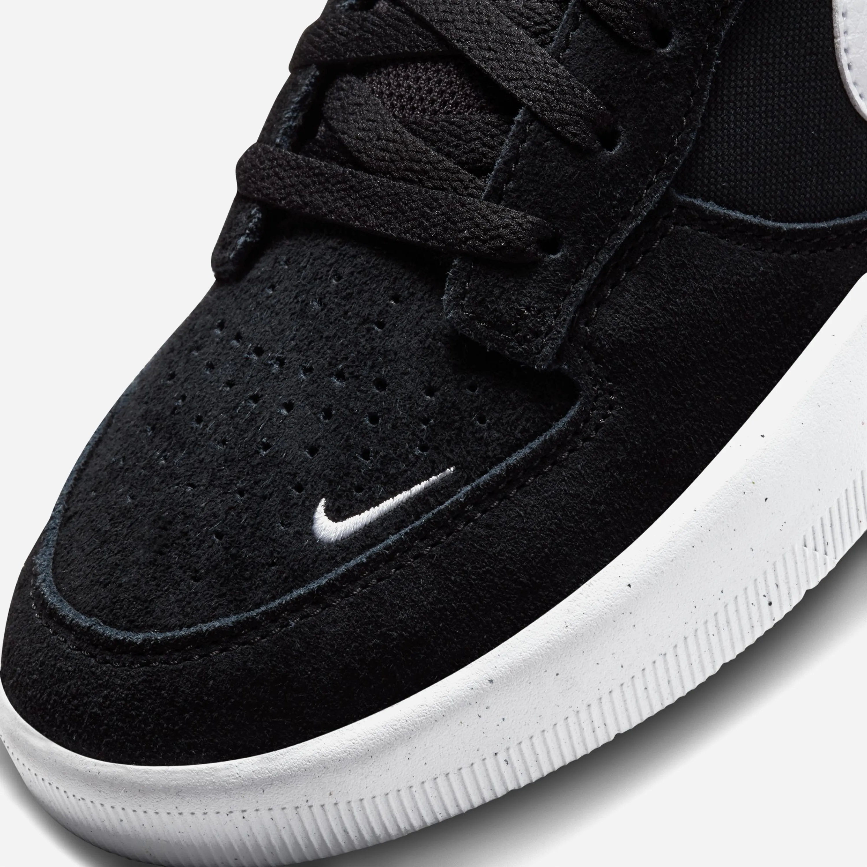Nike SB Force 58 black and white colorway, cupsole outsole, toe Swoosh and perforation detail