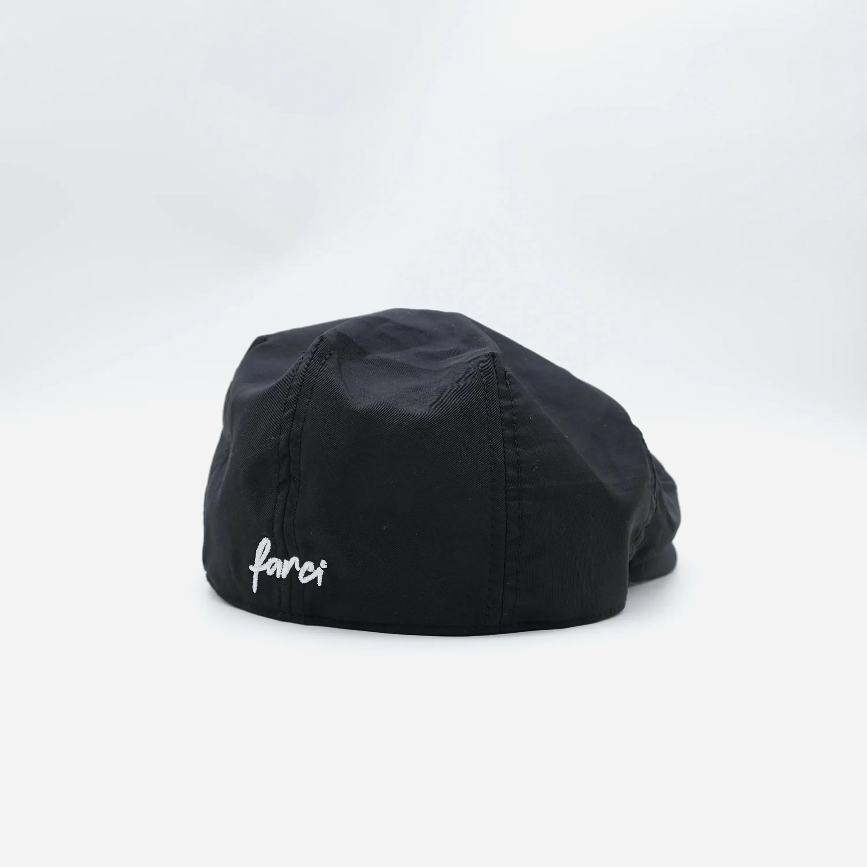 Farci Studio black 6-panel cotton twill beret, white script embroidery, flat peak, one size — three-quarter product view