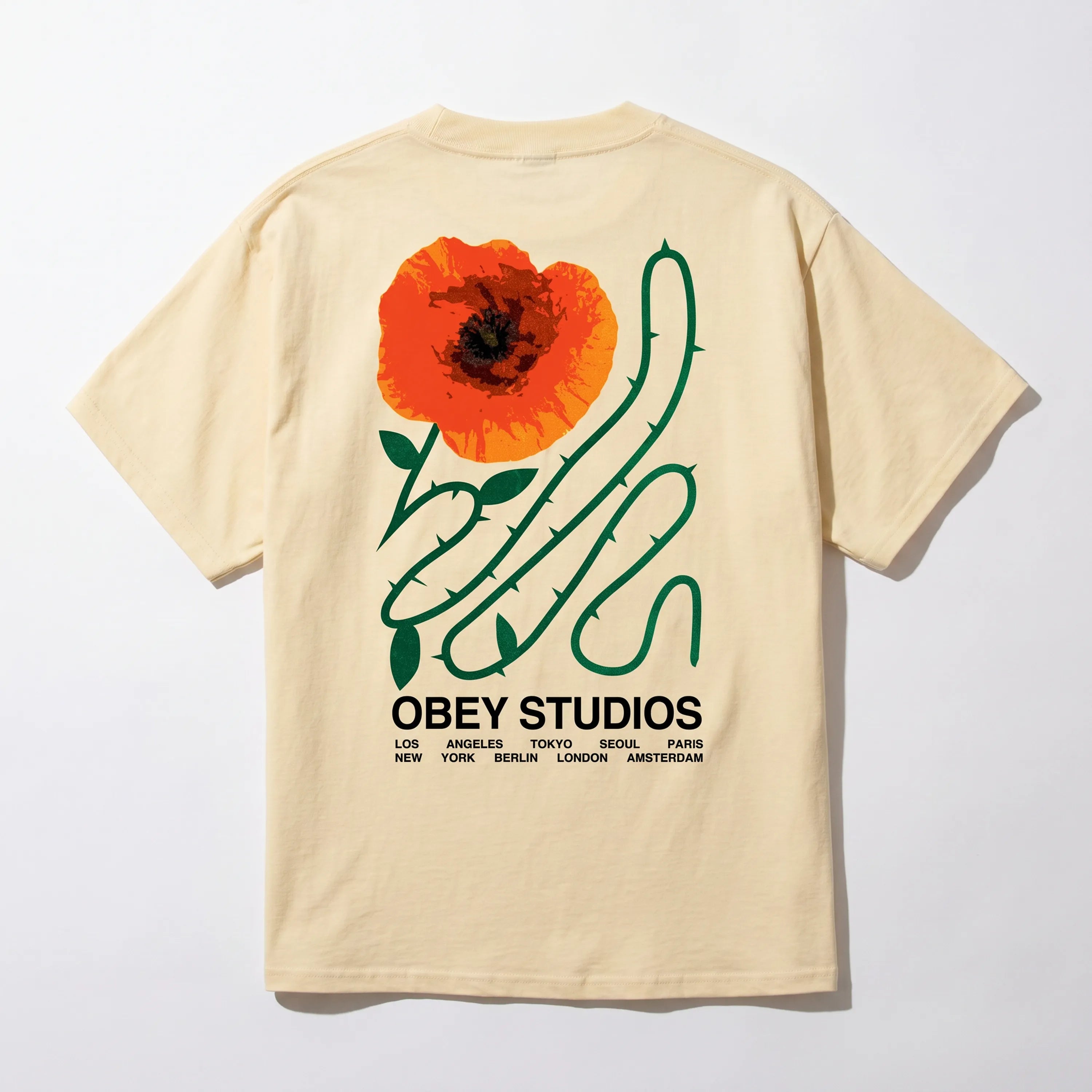 Back view of the Obey Moves Of Life Pale Yellow tee showing the urban-inspired graphic art.