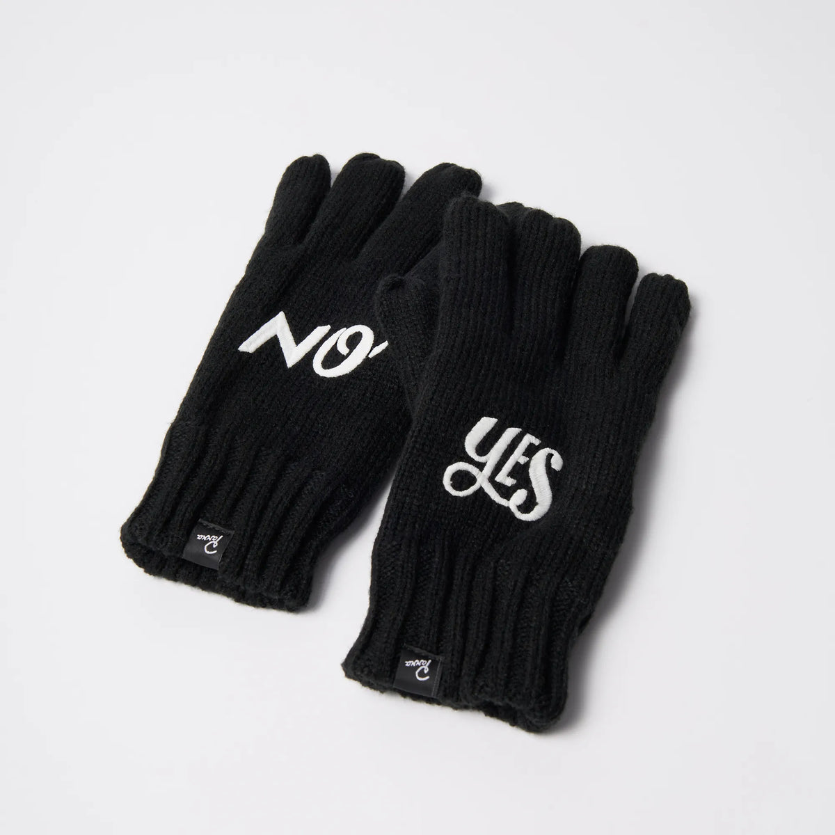 Pair of black Parra Maybe knitted gloves with embroidered yes and no lettering, fleece-lined, flat lay