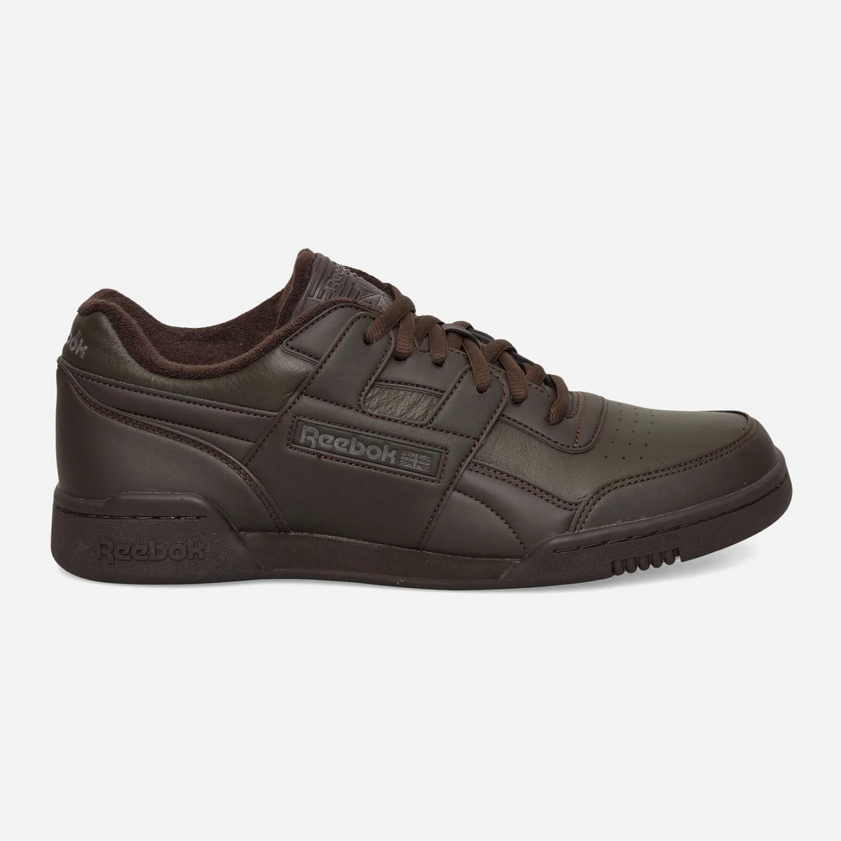 Pair of Reebok LTD Workout Plus OG Espresso Dark Brown sneakers in dark brown leather, three-quarter view with midfoot strap and flat brown laces