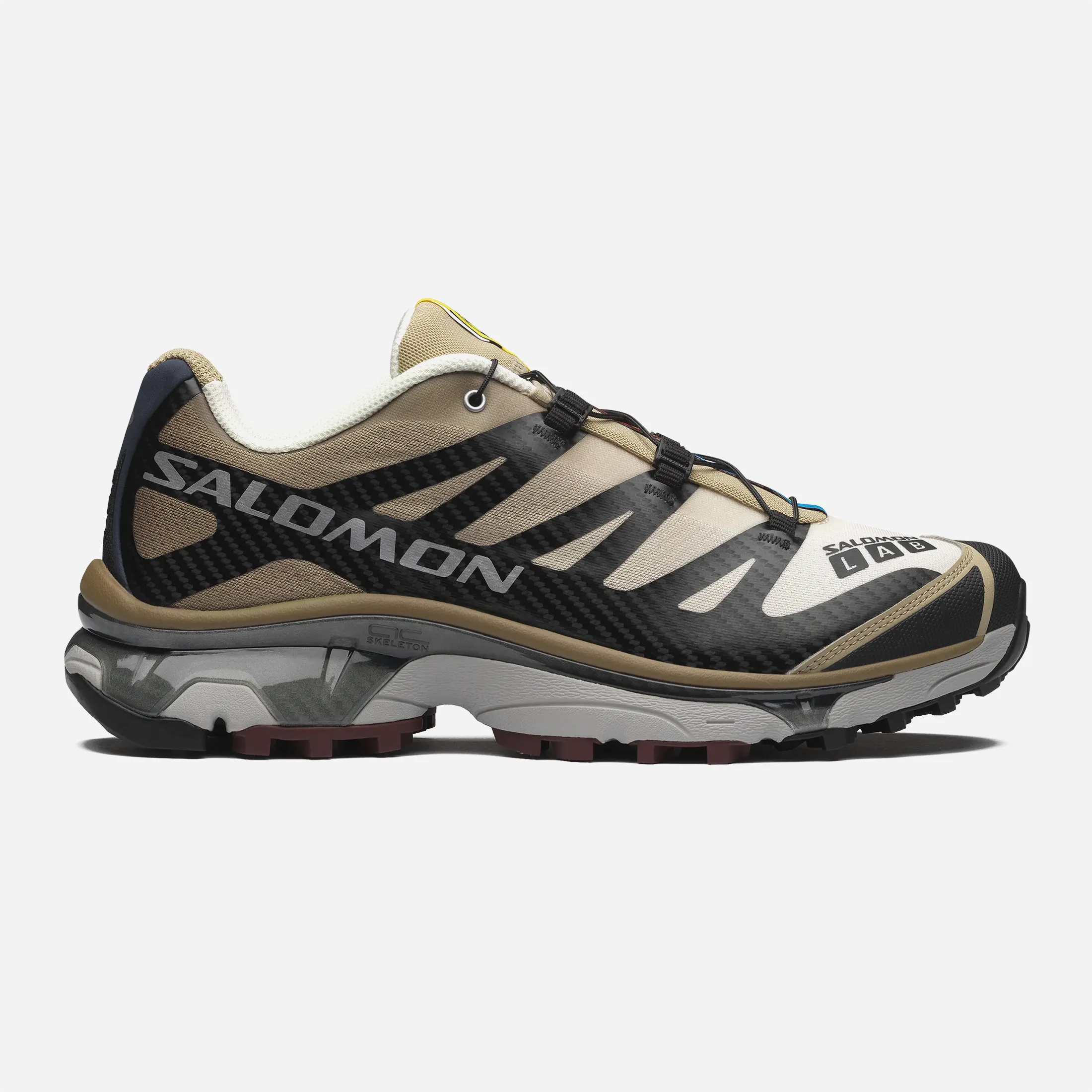 Side profile of the premium Salomon XT-4 OG Black Desert Tan sneakers featuring the SensiFIT cage and Contagrip sole.