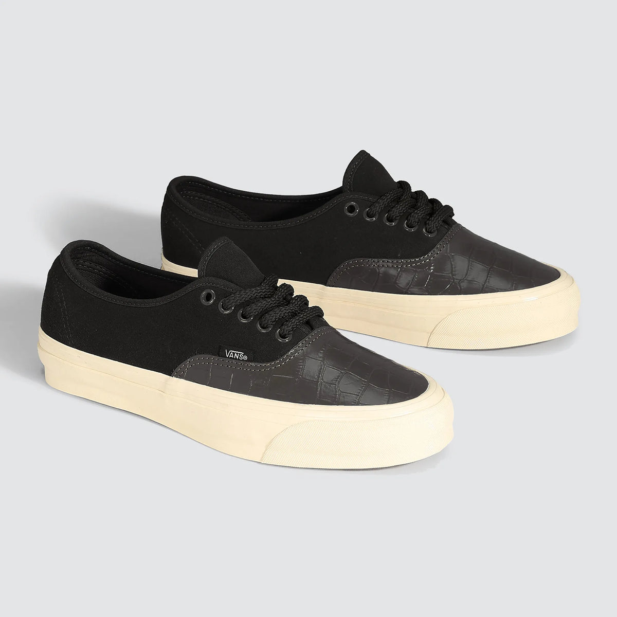 Pair of Vans LX Authentic 44 Black Sand White sneakers, black suede, glossy croc-embossed toe and sand-white sole, three-quarter view