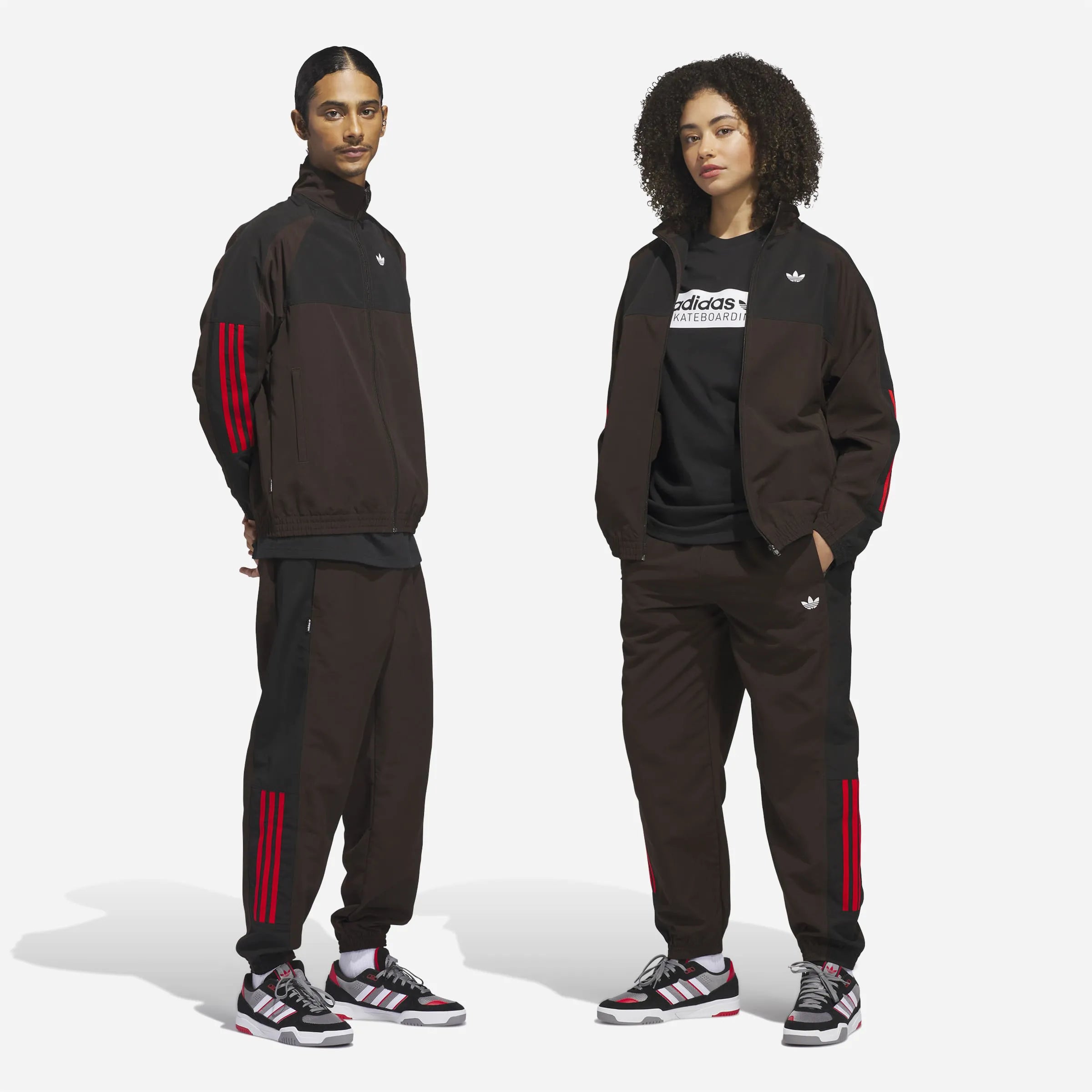 Couple wearing the full Adidas Gatsele brown and black tracksuit.