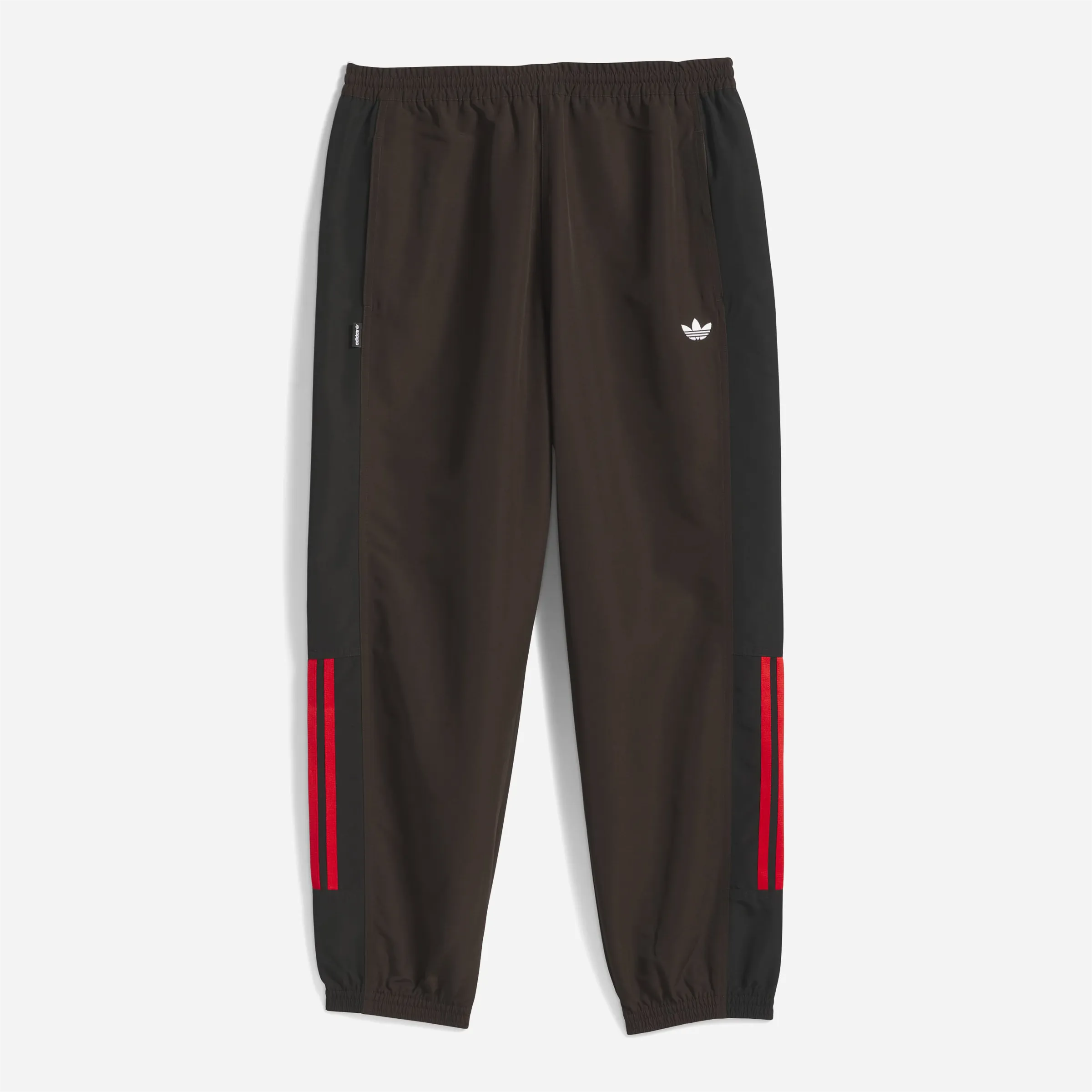 Adidas Skateboarding track pants in coffee brown and black.
