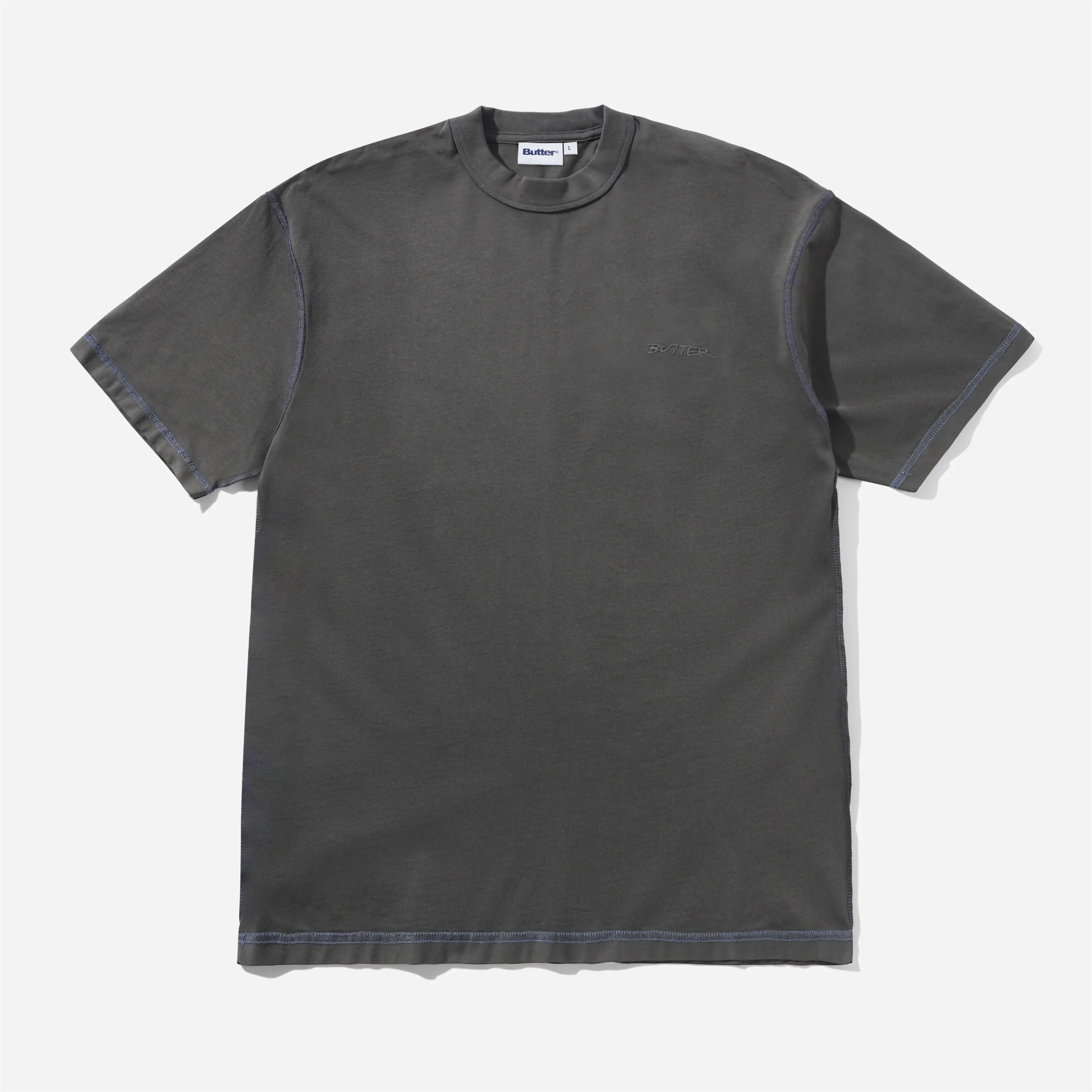 T-shirt manches courtes Butter Goods Inside Out Tee noir délavé en coton lourd avec coutures apparentes et broderie poitrine.