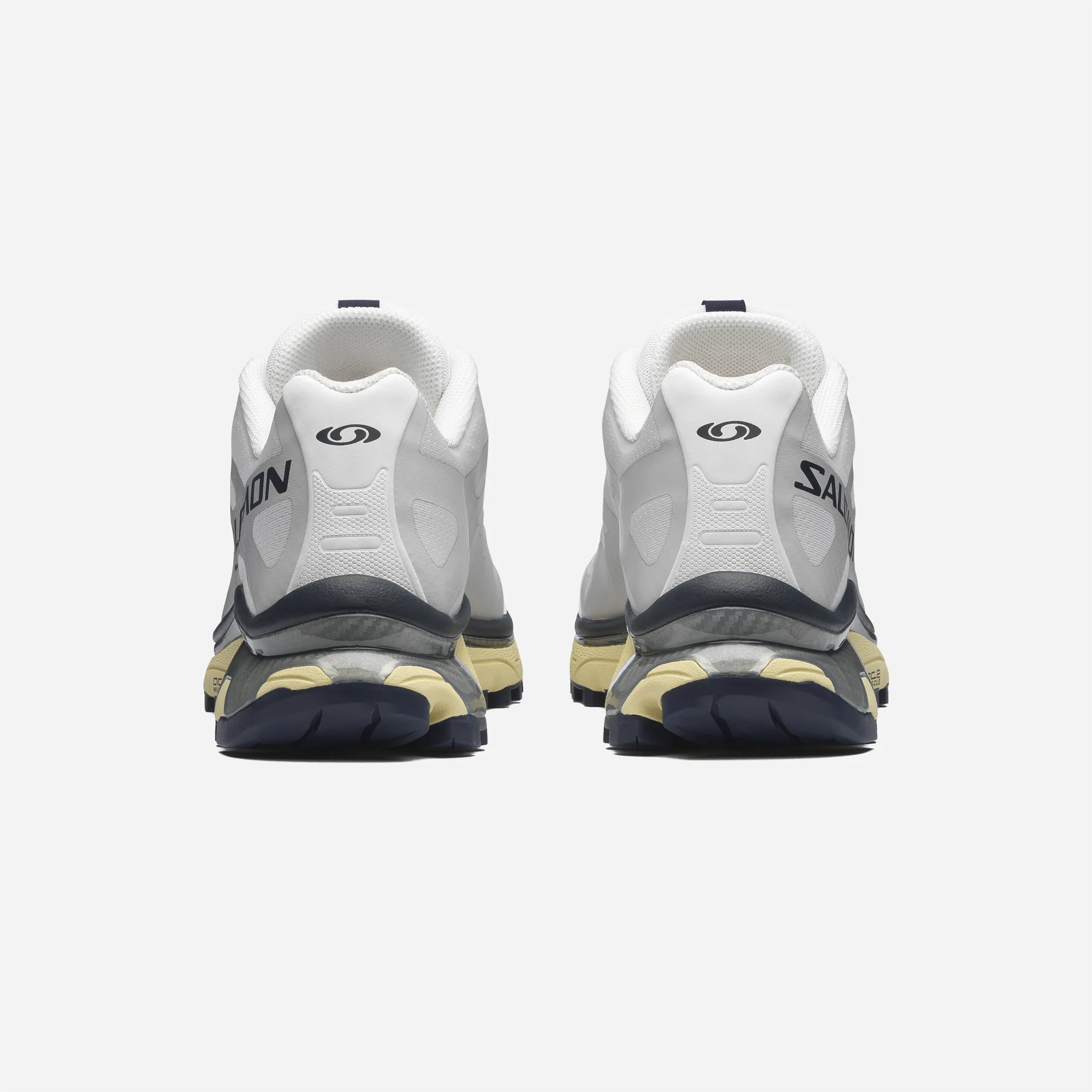 Back of the white Salomon XT-4 with logo and heel reinforcement.