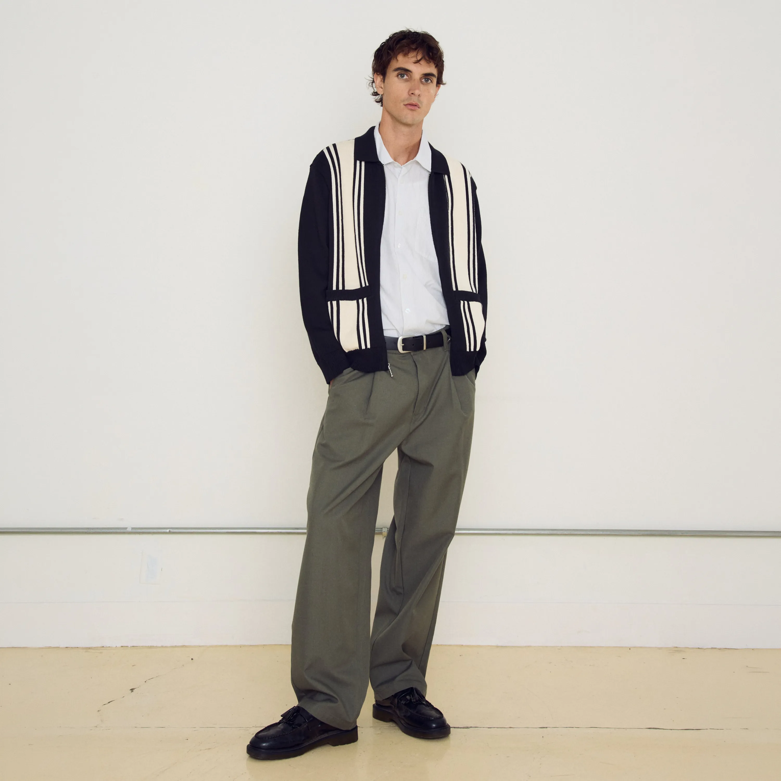 Front view of the Obey Dean Pleated pant in Tea Leaf green with front pleats.