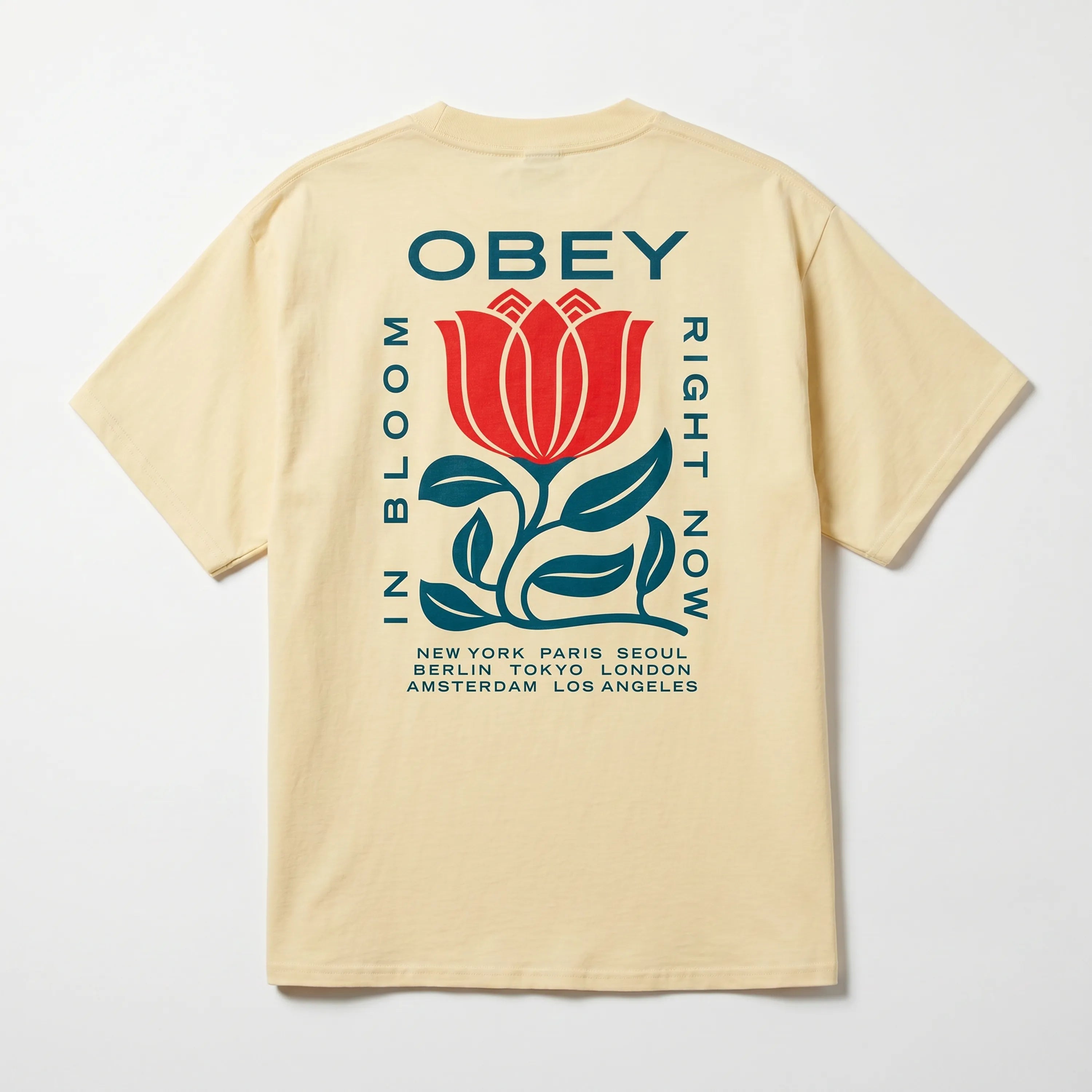 Back view of the Obey In Bloom Pale Yellow tee showing the floral graphic art.