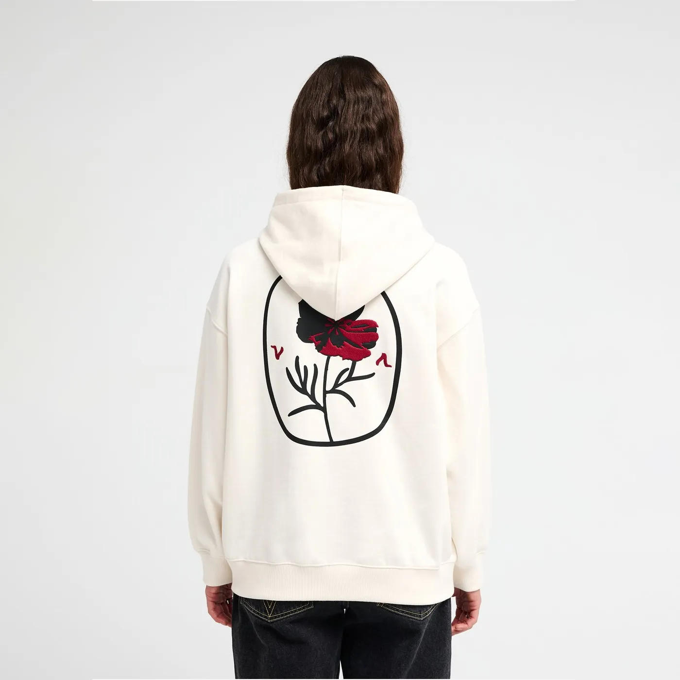 Rear view of the RVCA Odai zip hoodie showing the embroidered back graphic.