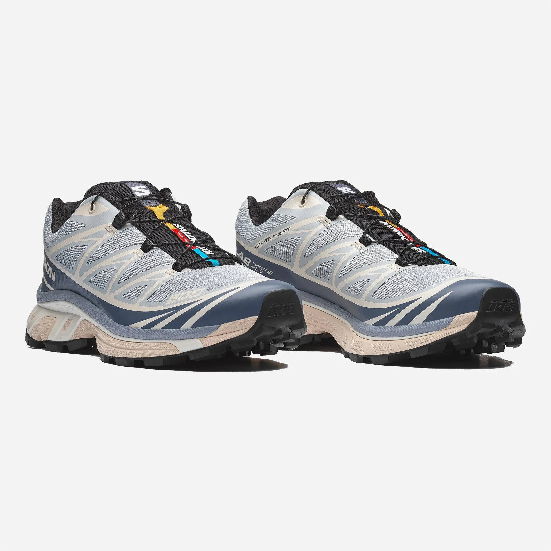 Front view of the pearl blue and grey Salomon XT-6 shoe featuring the Quicklace system and stone guard.