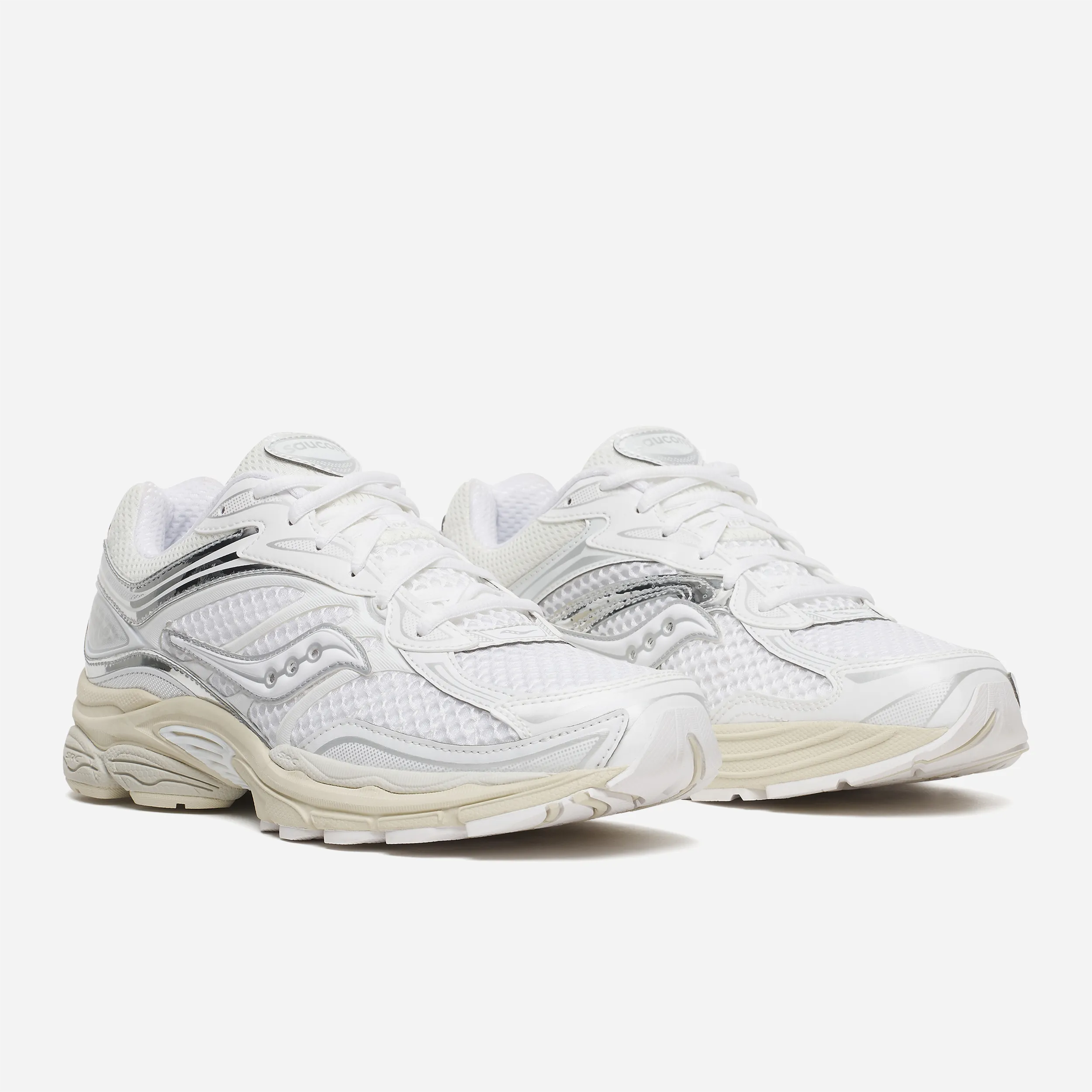 Saucony ProGrid Omni 9 coloris White Eggshell, empiècements chrome, détail semelle Grid Technology